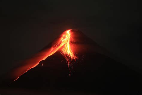 Most active Philippine volcano spews lava, locals ready to .